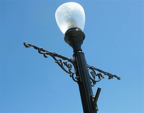 In Heart of Darkness, what are the decorative poles topped with .